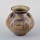 L'Art presents: 
Jais 
Nielsen for 
Royal 
Copenhagen.
Ceramic vase 
in sung glaze 
with religious 
motifs.