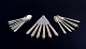 L'Art presents: 
Georg 
Jensen 
Pyramide.
Complete 
six-person 
dinner service 
in sterling 
silver.