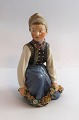 Lundin Antique 
presents: 
Royal 
Copenhagen. 
Amager Boy. 
Design by Carl 
Martin-Hansen. 
Model 12414. (1 
quality)