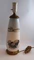 Lundin Antique 
presents: 
Royal 
Copenhagen. 
Porcelain lamp 
with bronze 
mounting. Model 
1274 / 184. 
Height 40 cm. 
...