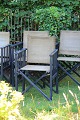 K&Co. presents: 
Older 
instructor's 
chair in black 
painted wood 
with strong 
natural-colored 
canvas fabric 
with a ...