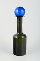 L'Art presents: 
Otto 
Brauer for 
Holmegaard. 
Large bottle 
vase in 
bottle-green 
art glass with 
blue stopper.
