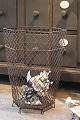 K&Co. presents: 
Old 
6-sided French 
wastepaper 
basket in Fil 
de Fer with a 
really nice 
patina...