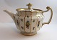 Lundin Antique 
presents: 
Royal 
Copenhagen. 
Henriette. 
Teapot. Model 
444-8503. 
Height 13 cm. 
(1 quality).