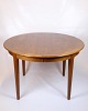 Osted Antik & 
Design 
presents: 
Round 
Dining Table 
With Extension 
Leaves - Teak - 
Danish Design - 
1960s
