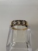 Antik Huset 
presents: 
14 karat 
red/white gold, 
Women's ring 
with 3 clear 
stones.
Ring size 55.