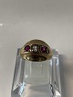 Antik Huset 
presents: 
8 carat 
gold, Ladies 
ring with 2 red 
and 1 clear 
stone.
Ring size 52.