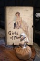 K&Co. presents: 
Decorative 
French Art Deco 
book cover from 
the 20s with a 
motif of a 
lightly dressed 
woman...