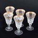 L'Art presents: 
Five 
crystal glasses 
with gilt rim, 
mid-20th 
century.
