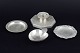 L'Art presents: 
Just 
Andersen, 
Denmark.
Collection of 
three small 
pewter dishes 
and a 
candlestick.