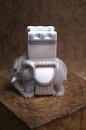 K&Co. presents: 
Bing & 
Grondahl 
porcelain 
figurine in the 
shape of an 
elephant 
with grey 
glaze...