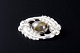 L'Art presents: 
Kaj 
Bojesen, 
Randers
Oval silver 
brooch set with 
a cabochon-cut 
cat’s eye 
(chrysoberyl).