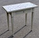 Pegasus – Kunst 
- Antik - 
Design 
presents: 
Louis XVI 
white painted 
tile table, 
20th century.