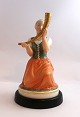 Lundin Antique 
presents: 
Royal 
Copenhagen. The 
girl with the 
golden horn. 
Model 12242 
Height 21 cm. 
(1 quality)
