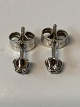Antik Huset 
presents: 
Earrings 
with a diamond 
in 14 carat 
white gold.