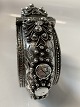 Antik Huset 
presents: 
Silver 
bangle with a 
beautiful 
pattern, with 
many details.
Measures 6 x 
5.2 cm.