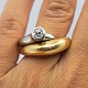 Antik 
Damgaard-
Lauritsen 
presents: 
Ole 
Lynggaard; 
Fidelity ring 
of 14k gold and 
white gold, set 
with diamond