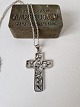 Karstens Antik 
presents: 
Silver 
necklace with 
large silver 
cross decorated 
with flowers by 
Eiler & Marløe