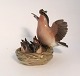 Lundin Antique 
presents: 
Dahl 
Jensen. 
Porcelain 
figurine. Bird 
on nest. Model 
# 1349. Height 
12.5 cm. (1 
quality)