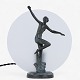 Roxy Klassik 
presents: 
Unknown
Table lamp 
with dancing 
woman in 
patinated 
bronze and 
glass shade.
1 pc. in ...