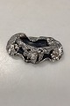 Danam Antik 
presents: 
Ornamented 
Jacob Hull 
Brooch in 
Silver Plated 
Metal with 
Black Stone