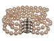 Antik K 
presents: 
Double row 
pink Akoya 
pearl bracelet 
with 14 carat 
white gold 
pendant with 
sapphires