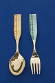 Antikkram 
presents: 
Michelsen 
Set Christmas 
spoon and fork 
1960 of Danish 
gilt sterling 
silver