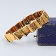 Antik 
Damgaard-
Lauritsen 
presents: 
Toftegaard; 
bracelet in 14k 
gold