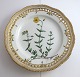Lundin Antique 
presents: 
Royal 
Copenhagen. 
Flora Danica 
plate w. 
open-work 
border. 
Diameter 25 cm. 
Model 3553. ...