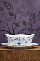 K&Co. presents: Royal Copenhagen, Blue Fluted Plain sauce pot on a solid saucer. 1/204. 1923-28...