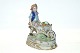 Antik Huset presents: Figure of boy with vegetables in a wheelbarrow.