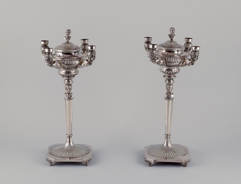 A pair of large and impressive Italian candlesticks in silver.