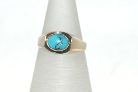Gold ring with light blue stones