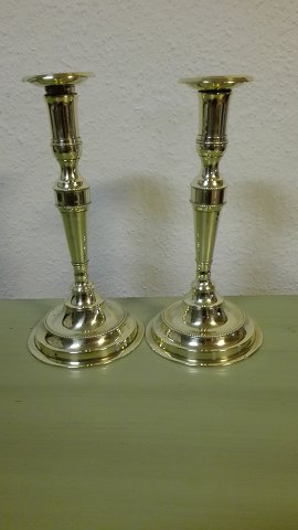 A pair of high Danish brass candlesticks stamped 
Lassen