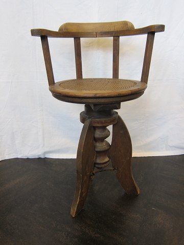 Chair from a child hairdresser 
Antique chair from a child hairdresser with a seat made of canework
From the beginning of the 1900