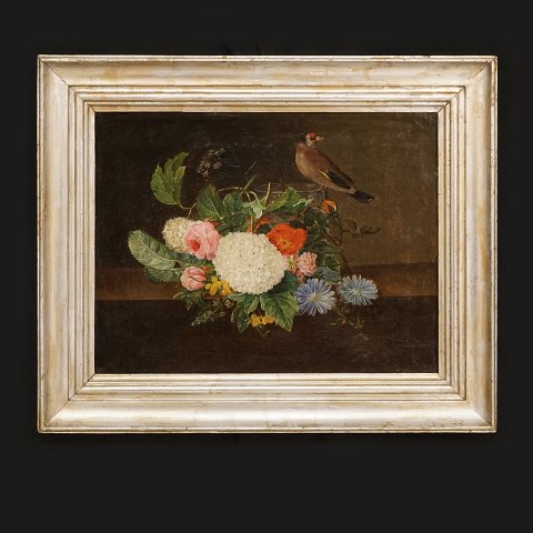 A Danish painting, flowers on a table with a vase 
and a bird. Denmark circa 1830. Visible size: 
27x36cm. With frame: 39x48cm
