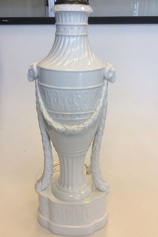 Royal Copenhagen baluster-shaped lamps on base decorated with garlands, Ram 
heads With Juliane Marie Stamp from 1905-12. Mounted wire.