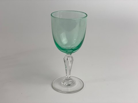 Green Holmegaard Pfeiffer glass for white wine. Smooth, green bowl and faceted 
stem