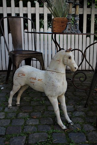 Swedish 1800 century horse in wood old scraped original off-white color and a 
super fine patina.
H:58cm. L:62cm.
