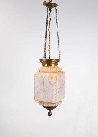 Antique pendant of orange opaline glass with brass edge and suspension from 
around 1860.
5000m2 showroom.
