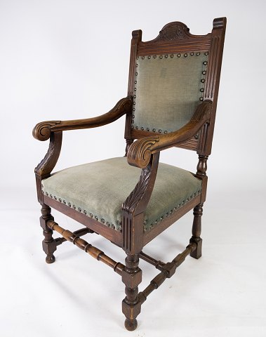 Armchair of walnut and upholstered with dark green fabric, in great antique 
condition from the 1910s. 
5000m2 showroom.