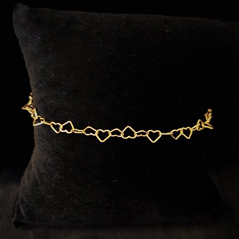 A bracelet with hearts made in 8k gold