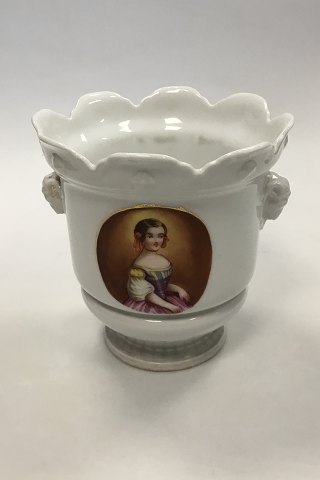 Flowerpot Cover of white porcelain decorated with Ram heads and women portraits