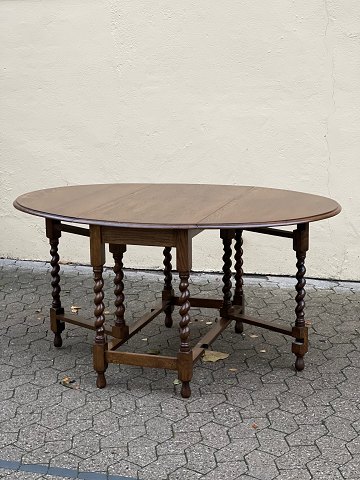 Gate-leg table / folding table in oak with twisted legs.