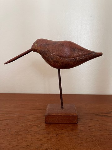 Wooden bird on stand
