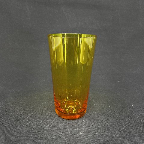 Golden orange soda glass from Holmegaard