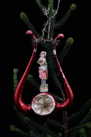 Old glass Christmas ornament with glossy image from around 1920...