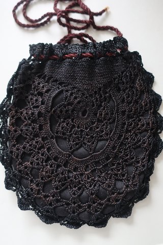 An antique beautiful handbag, handmade 
The closing is made with a string
Inside there is fabric