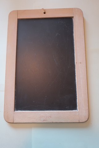 An blackboard/slate mad of slate with an edge of wood