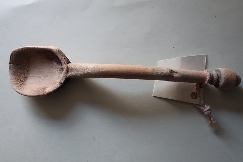 An old spoon, made by hand, made of wood